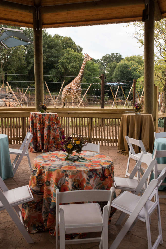 Decorated tables in Twiga Terrace with two giraffes