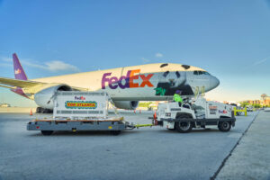2019-Present: A New Era of Transformation 5 An image of the giant pandas arrival, a large plane sits in the background with a panda graphic. A crate is carefully unloaded via truck.