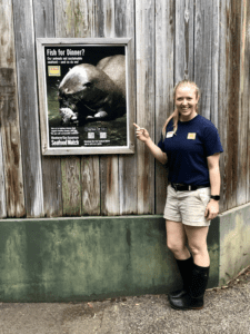 Sam with poster promoting sustainable seafood
