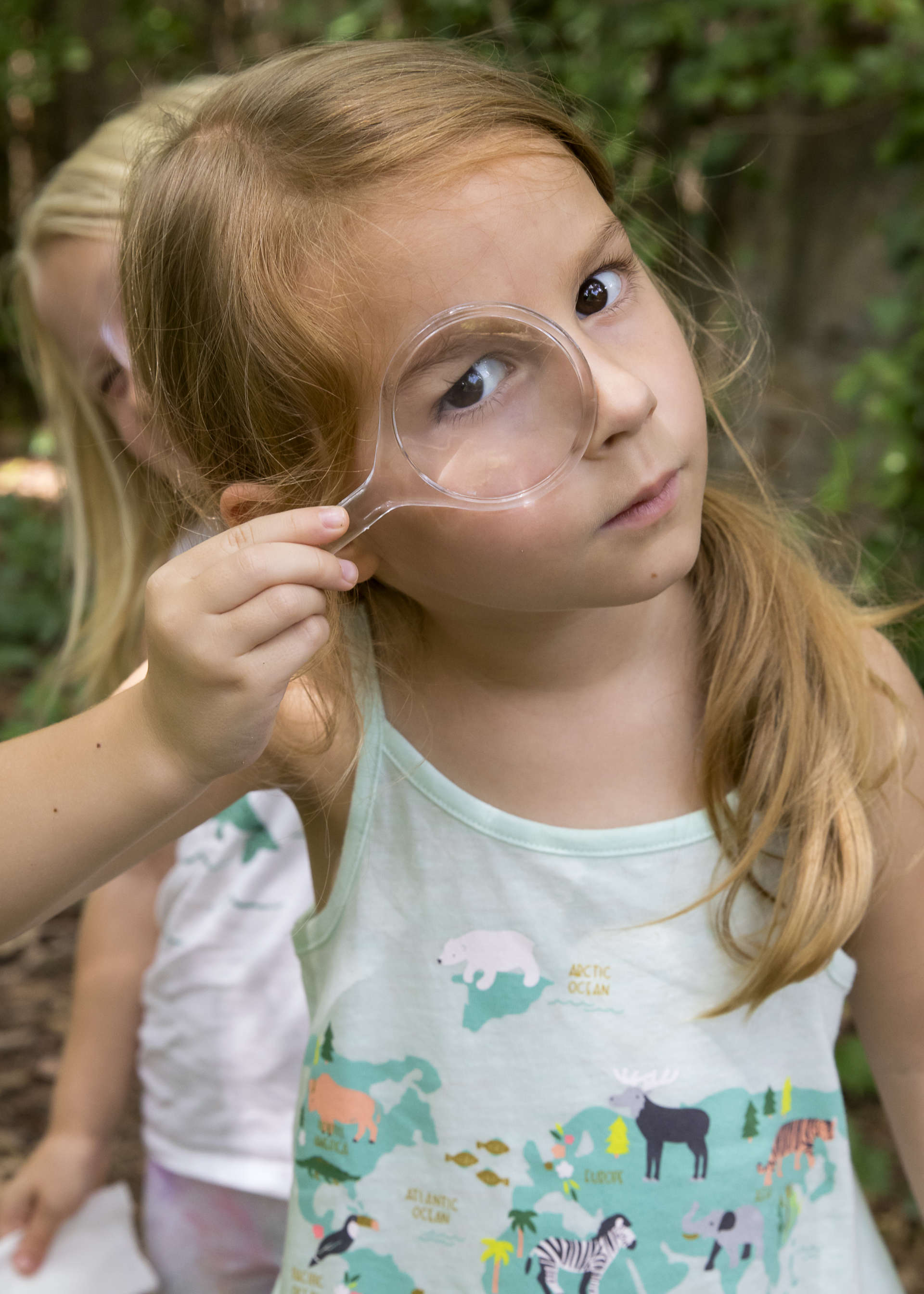 Little camper with magnifying glass