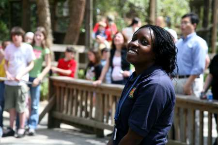 A Zoo Atlanta teammate mans the Canopy Climber queue line.