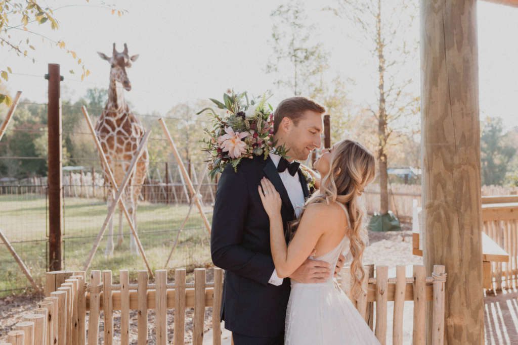 Wedding couple in Twiga Terrace with giraffe