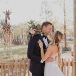 Wedding couple in Twiga Terrace with giraffe